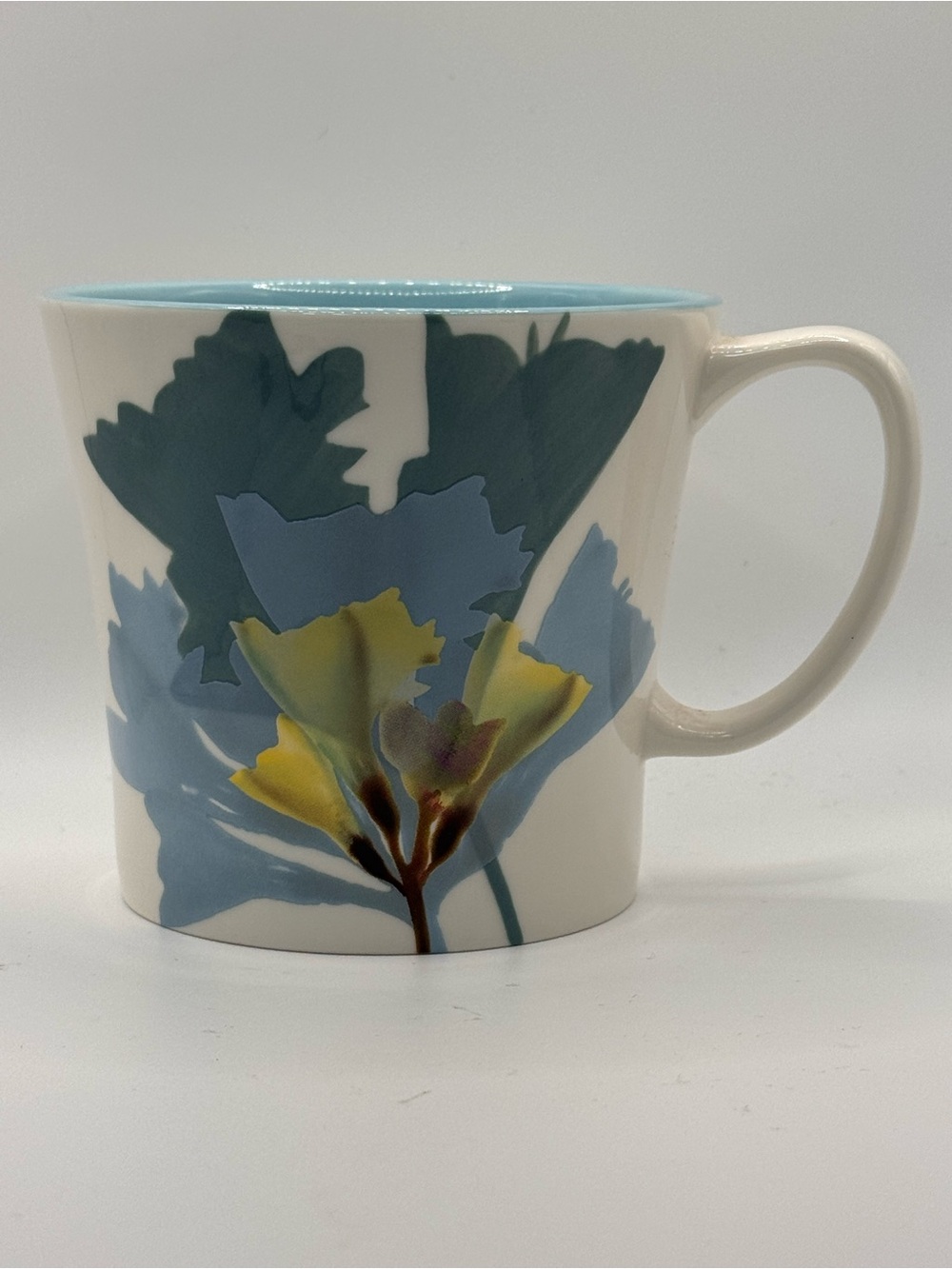 Starbucks 2009 Blue Hand Painted Floral Coffee Mug. 14 fl oz.